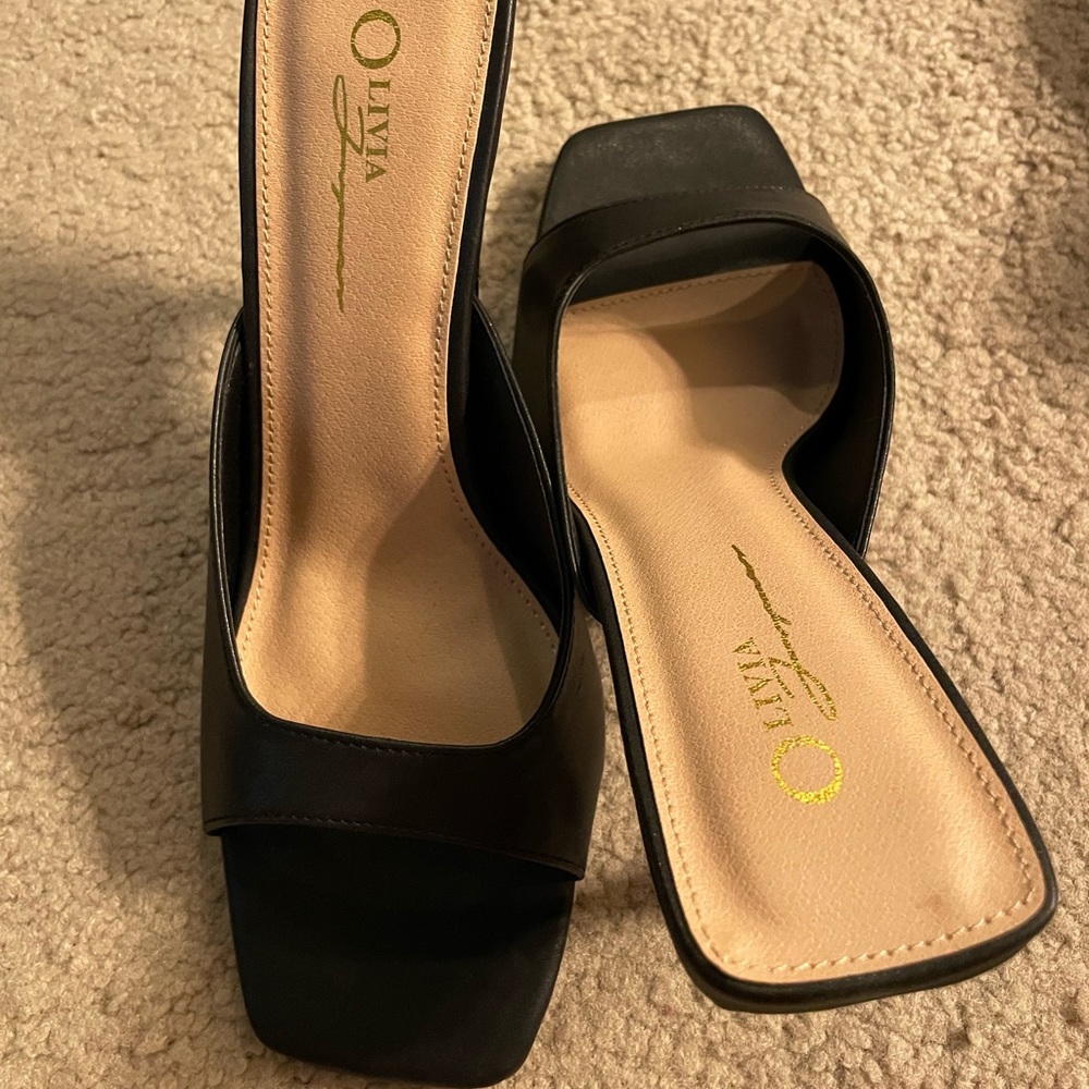 New never worn. Black slip on sandal heels.